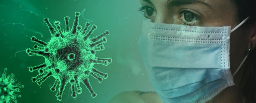 La cara d'una dona amb mascareta al davant d'un coronavirus