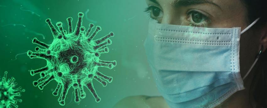 La cara d'una dona amb mascareta al davant d'un coronavirus