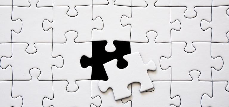 Imatge d'un puzzle amb una peça pendent d'encaixar